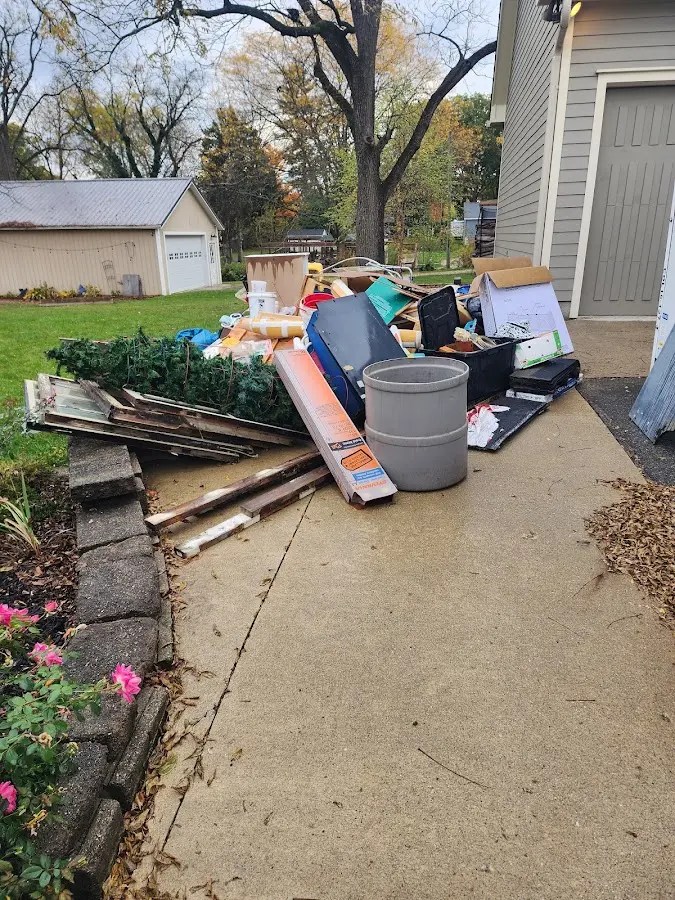 Dumpster being loaded with debris for Commercial Dumpster Rental in Skowhegan